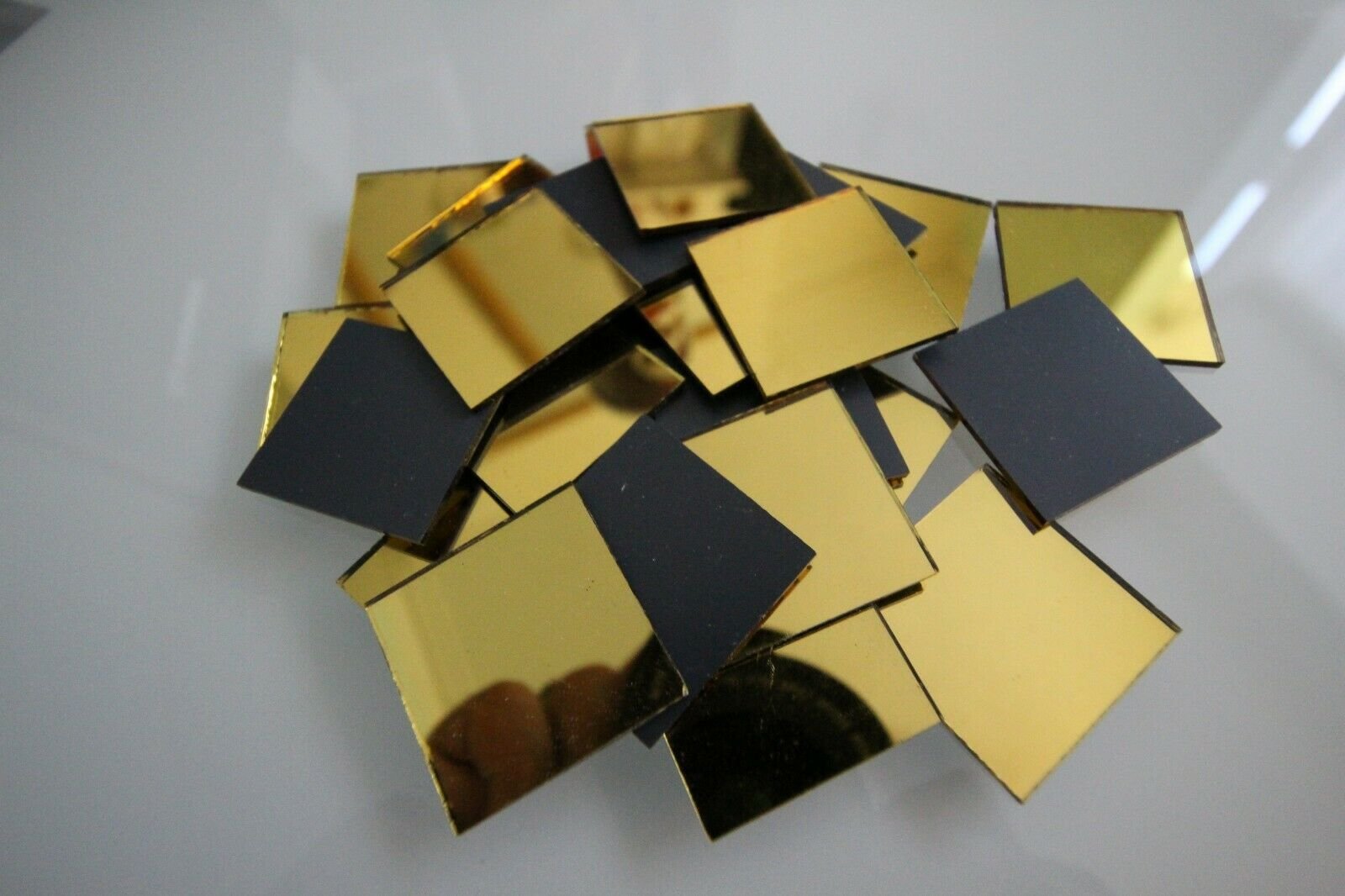 Mosaic mirror glass 2 x 2 cm square pieces.